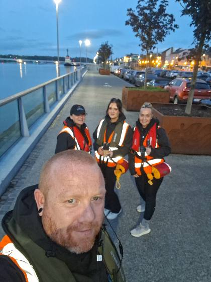 A patrol team selfie on the quay at dusk