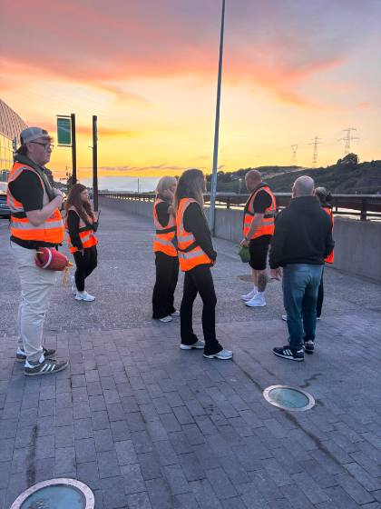 The team gathered on the Greenway at sunset