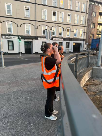 Volunteers keeping watch with binoculars on the bridge